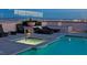 Rooftop pool with city view, lounge chairs, and hot tub at 150 N Las Vegas Blvd # 1217, Las Vegas, NV 89101