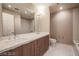 Bathroom with double vanity, quartz countertop, modern fixtures, and white marble floor at 150 N Las Vegas Blvd # 2302, Las Vegas, NV 89101