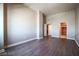 Bedroom with wood-look flooring, base molding, and open closet at 150 N Las Vegas Blvd # 2302, Las Vegas, NV 89101