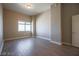 Bedroom featuring wood-look floors, base molding, a window and neutral paint at 150 N Las Vegas Blvd # 2302, Las Vegas, NV 89101