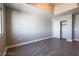 Empty bedroom with gray walls, closet, and wood-look floors at 150 N Las Vegas Blvd # 2302, Las Vegas, NV 89101