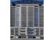 Striking exterior view of a modern high-rise condominium with multiple balconies and architectural details at 150 N Las Vegas Blvd # 2302, Las Vegas, NV 89101