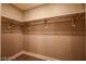 Spacious walk-in closet with built-in shelving and metal hanging rods for optimal storage at 150 N Las Vegas Blvd # 2302, Las Vegas, NV 89101