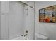 Nicely tiled tub and shower combination featuring gold fixtures and eye-catching design at 1575 W Warm Springs Rd # 1124, Henderson, NV 89014