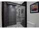 Bathroom with a shower featuring black and white decorative tiles and a glass door at 1575 W Warm Springs Rd # 1124, Henderson, NV 89014
