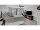 Bedroom showcasing a queen bed, a TV, and a desk workspace at 1575 W Warm Springs Rd # 1124, Henderson, NV 89014
