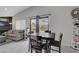 Dining area with outdoor views, table and chairs next to living room at 1575 W Warm Springs Rd # 1124, Henderson, NV 89014