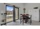 Dining area with table and view of the outdoor balcony at 1575 W Warm Springs Rd # 1124, Henderson, NV 89014