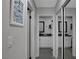 Hallway with multiple doorways leading to a bathroom with a large vanity at 1575 W Warm Springs Rd # 1124, Henderson, NV 89014