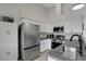 Modern kitchen featuring stainless steel appliances and white cabinets at 1575 W Warm Springs Rd # 1124, Henderson, NV 89014