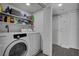 Well-organized laundry room with a modern washer and dryer and ample shelving for storage at 1575 W Warm Springs Rd # 1124, Henderson, NV 89014