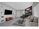 Open-concept living room with large TV, fireplace, and comfortable seating at 1575 W Warm Springs Rd # 1124, Henderson, NV 89014