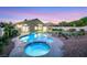 Enjoy a backyard with a sparkling pool and spa, manicured landscaping, and a charming covered patio at 1594 Pontine Ct, Henderson, NV 89052