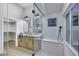 Well-lit bathroom with double vanity, tub and separate glass shower at 1594 Pontine Ct, Henderson, NV 89052