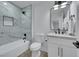 Bathroom featuring modern fixtures, a marble tiled shower, vanity with a modern mirror and sleek design at 1594 Pontine Ct, Henderson, NV 89052