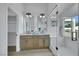 This bathroom features a double vanity, glass shower, and a separate toilet area at 1594 Pontine Ct, Henderson, NV 89052