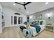 Stylish primary bedroom complete with ensuite access, fireplace, and modern ceiling fan at 1594 Pontine Ct, Henderson, NV 89052