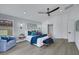 Bright bedroom boasts a modern bed, accent chair, and access to ensuite bathroom at 1594 Pontine Ct, Henderson, NV 89052