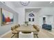 Dining area features a rustic wooden table, modern decor and stylish seating, open to the entry way at 1594 Pontine Ct, Henderson, NV 89052