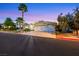A well-maintained home featuring desert landscaping, exterior lighting, a tile roof, and a three-car garage at 1594 Pontine Ct, Henderson, NV 89052