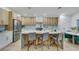 Kitchen with stainless steel appliances, a spacious island with seating, and contemporary-style cabinets at 1594 Pontine Ct, Henderson, NV 89052