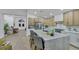 Kitchen featuring an island with seating, stainless steel appliances, and contemporary-style cabinets overlooking dining area at 1594 Pontine Ct, Henderson, NV 89052