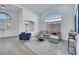 Bright living room with vaulted ceiling, large window, and stylish furniture at 1594 Pontine Ct, Henderson, NV 89052