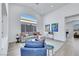 Bright living room with vaulted ceiling, large window, and stylish furniture at 1594 Pontine Ct, Henderson, NV 89052