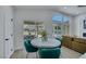 Open living space showcasing pool view from dining area with modern finishes at 1594 Pontine Ct, Henderson, NV 89052