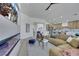 Bright, open living room with modern fireplace, sleek ceiling fan, and comfortable contemporary furnishings at 1594 Pontine Ct, Henderson, NV 89052
