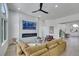 Bright living room featuring a modern fireplace, contemporary furnishings, and an open floor plan into the dining area at 1594 Pontine Ct, Henderson, NV 89052
