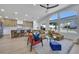 Bright open living space with a modern kitchen, dining area, and comfortable living room with natural light at 1594 Pontine Ct, Henderson, NV 89052