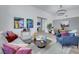 Open-concept living room and dining area with stylish decor and modern lighting at 1594 Pontine Ct, Henderson, NV 89052