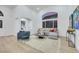 Bright living room with vaulted ceiling, large window, and stylish furniture at 1594 Pontine Ct, Henderson, NV 89052