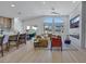 Open-concept space with a modern kitchen, dining area, and a cozy living room with a large window at 1594 Pontine Ct, Henderson, NV 89052