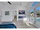 The primary bedroom showcases a fireplace, ensuite bathroom and views of the yard and pool at 1594 Pontine Ct, Henderson, NV 89052