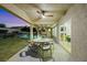 Enjoy the outdoor covered patio with ceiling fan, dining area and view of the lush backyard with pool at 1594 Pontine Ct, Henderson, NV 89052