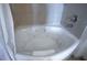 Corner soaking tub in bathroom with beige tile at 200 W Sahara Ave # 3312, Las Vegas, NV 89102