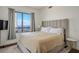 Bedroom featuring a large window with city views and neutral decor at 200 W Sahara Ave # 3312, Las Vegas, NV 89102
