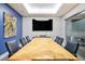 Modern conference room featuring a large wood table, comfortable seating, and a sleek design at 200 W Sahara Ave # 3312, Las Vegas, NV 89102