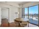 Dining area featuring a round table with chairs, wooden flooring, and large windows offering city views and natural light at 200 W Sahara Ave # 3312, Las Vegas, NV 89102