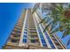 High-rise with wrap-around balconies, floor-to-ceiling windows, with palm trees in view on a beautiful, sunny day at 200 W Sahara Ave # 3312, Las Vegas, NV 89102