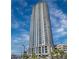 Striking high-rise building with modern architecture, balconies, and abundant windows under a blue, partly cloudy sky at 200 W Sahara Ave # 3312, Las Vegas, NV 89102