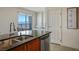 Kitchen with stainless steel sink and a view of the city at 200 W Sahara Ave # 3312, Las Vegas, NV 89102