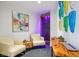 Relaxing lounge area with comfortable seating, modern art, and a unique water feature for a serene atmosphere at 200 W Sahara Ave # 3312, Las Vegas, NV 89102