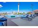 Beautiful rooftop pool with comfortable lounge chairs and stunning views of the city skyline and Stratosphere at 200 W Sahara Ave # 3312, Las Vegas, NV 89102