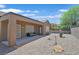 Charming backyard with gravel landscaping, covered patio, and seating area at 2091 Waterton Rivers Dr, Henderson, NV 89044