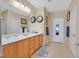 Bright bathroom featuring double sinks, neutral walls, and tiled flooring at 2091 Waterton Rivers Dr, Henderson, NV 89044