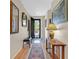 Hallway with beautiful flooring, stylish decor, and a view of the front door showcasing the home's welcoming ambiance at 2091 Waterton Rivers Dr, Henderson, NV 89044