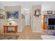 Neutral hallway featuring wood floors, neutral walls, and tasteful decor and lighting at 2091 Waterton Rivers Dr, Henderson, NV 89044